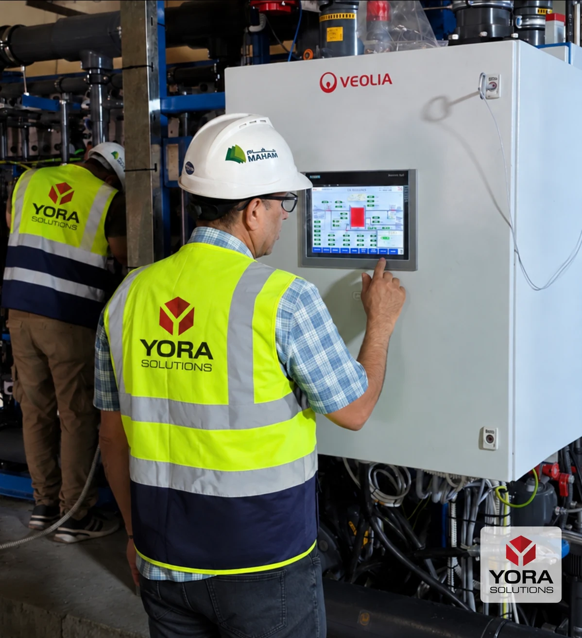 Project team member at the EDI control panel during site work at Al Quds Thermal Plant
